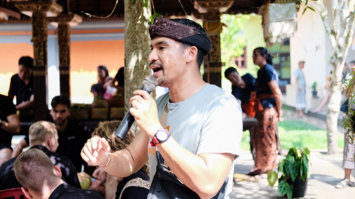 Local guide welcoming guests at Wisma Kaka